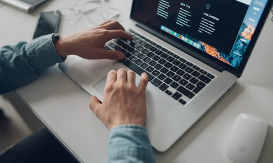 a professional typing away on their laptop for work