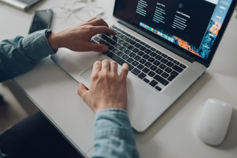 a professional typing away on their laptop for work