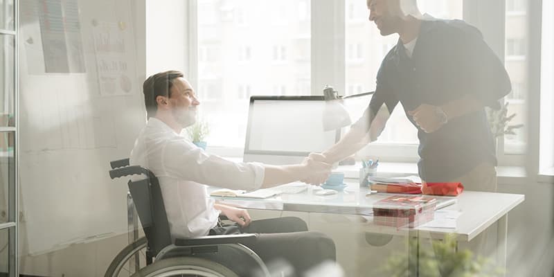 an ndis service provider shaking hands with a participant