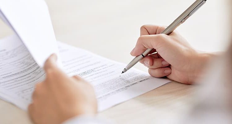 person signing an ndis service agreement