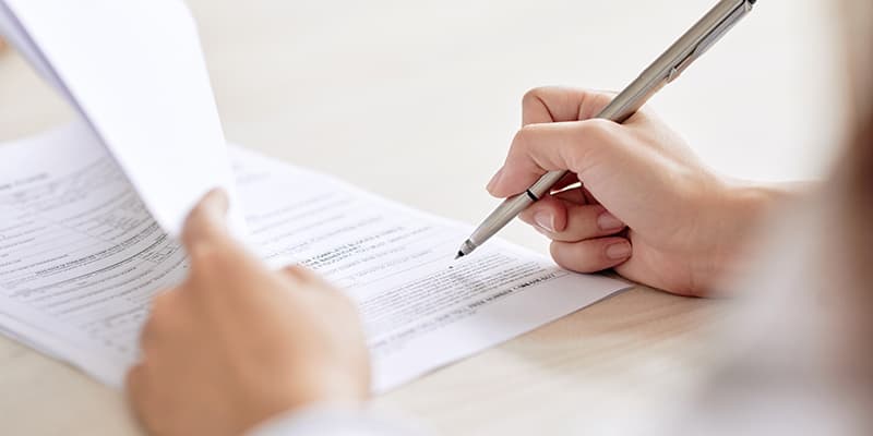 person signing an ndis service agreement